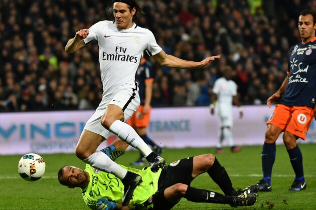 Montpellier's French goalkeeper Laurent Pionnier (Bottom) vies with Paris Saint-Germain's Uruguayan forward Edinson Cavani during the French L1 football match between MHSC Montpellier and Paris Saint-Germain (PSG) on December 3, 2016 at the La Mosson stadium in Montpellier, southern France. / AFP / PASCAL GUYOT        (Photo credit should read PASCAL GUYOT/AFP/Getty Images)