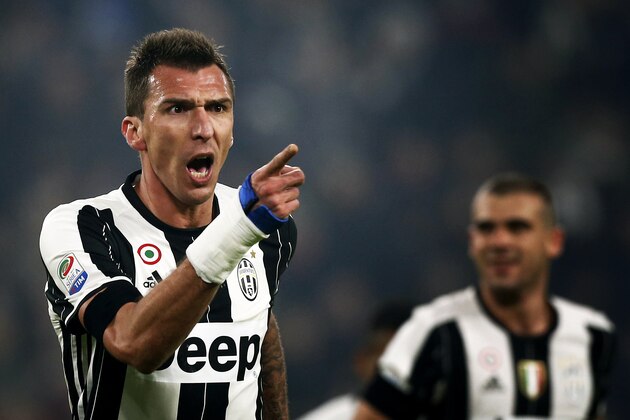 Juventus' Croatian forward Mario Mandzukic celebrates after scoring a goal during the Italian Serie A football match between Juventus and Atalanta on December 3, 2016 at the 'Juventus Stadium' in Turin. / AFP / MARCO BERTORELLO        (Photo credit should read MARCO BERTORELLO/AFP/Getty Images)