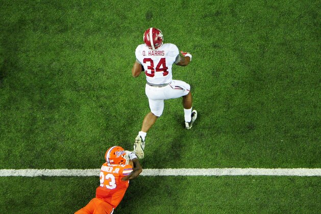 ATLANTA, GA - DECEMBER 03:  Damien Harris #34 of the Alabama Crimson Tide tries to break the tackle of Chauncey Gardner #23 of the Florida Gators in the second half during the SEC Championship game at the Georgia Dome on December 3, 2016 in Atlanta, Georgia.  (Photo by Scott Cunningham/Getty Images)