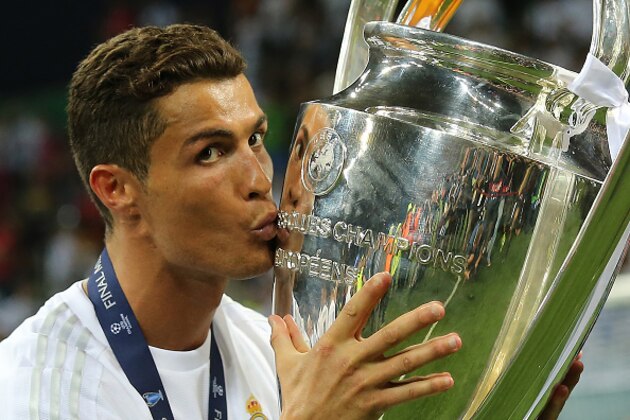 MILAN, ITALY - MAY 28:  Cristiano Ronaldo of Real Madrid celebrates with the trophy following his team's victory in a penalty shootout during the UEFA Champions League final match between Real Madrid and Club Atletico de Madrid at Stadio Giuseppe Meazza on May 28, 2016 in Milan, Italy.  (Photo by Matthew Ashton - AMA/Getty Images)