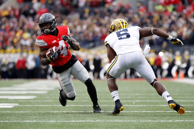 COLUMBUS, OH - NOVEMBER 26:   Curtis Samuel #4 of the Ohio State Buckeyes rushes the ball in overtime against the Michigan Wolverines at Ohio Stadium on November 26, 2016 in Columbus, Ohio.  (Photo by Gregory Shamus/Getty Images)