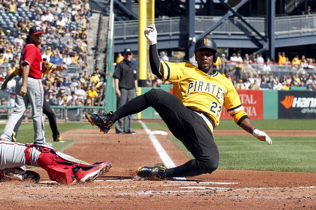 PITTSBURGH, PA - SEPTEMBER 25:  Andrew McCutchen #22 of the Pittsburgh Pirates slides into home during the game against the Washington Nationals at PNC Park on September 25, 2016 in Pittsburgh, Pennsylvania.  (Photo by Justin K. Aller/Getty Images)