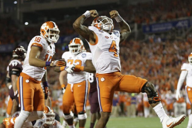 Clemson quarterback Deshaun Watson (4) celebrates his touchdown, during the second half of the Atlantic Coast Conference championship NCAA college football game against Virginia Tech, Saturday, Dec. 3, 2016, in Orlando, Fla. (AP Photo/Willie J. Allen Jr.)