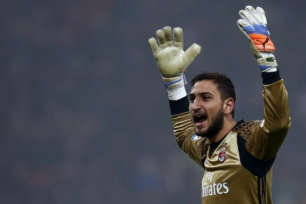 AC Milan's goalkeeper Gianluigi Donnarumma reacts during the Italian Serie A football match AC Milan Vs Inter Milan on November 20, 2016 at the 'San Siro Stadium' in Milan.  / AFP / MARCO BERTORELLO        (Photo credit should read MARCO BERTORELLO/AFP/Getty Images)