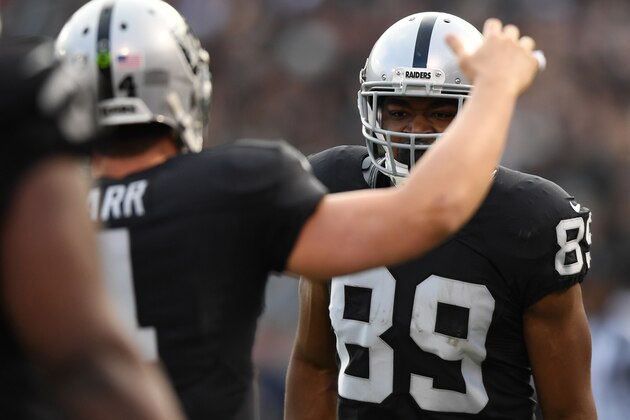 OAKLAND, CA - DECEMBER 04:  Amari Cooper #89 of the Oakland Raiders celebrates after a 37-yard touchdown with Derek Carr #4 during their NFL game against the Buffalo Bills at Oakland Alameda Coliseum on December 4, 2016 in Oakland, California.  (Photo by Thearon W. Henderson/Getty Images)