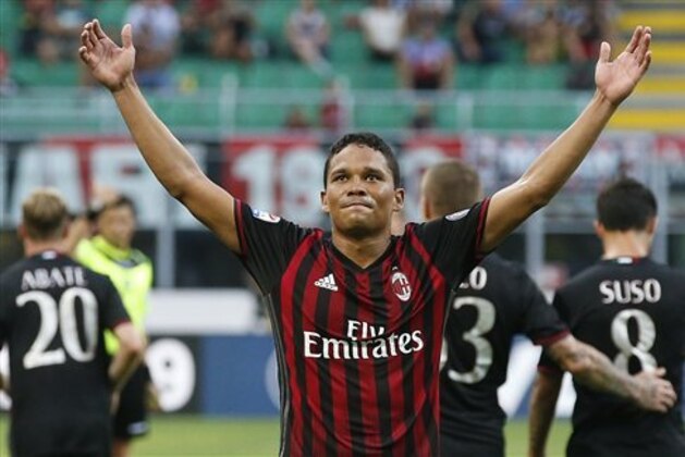 AC Milan's Carlos Bacca celebrates after scoring his third goal during the Serie A soccer match between AC Milan and Torino at the San Siro stadium in Milan, Italy, Sunday, Aug. 21, 2016. (AP Photo/Antonio Calanni)