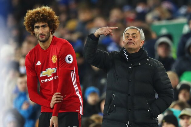 LIVERPOOL, ENGLAND - DECEMBER 04:  Jose Mourinho manager of Manchester United stands alongside substitute Marouane Fellaini of Manchester United during the Premier League match between Everton and Manchester United at Goodison Park on December 4, 2016 in Liverpool, England.  (Photo by Clive Brunskill/Getty Images)
