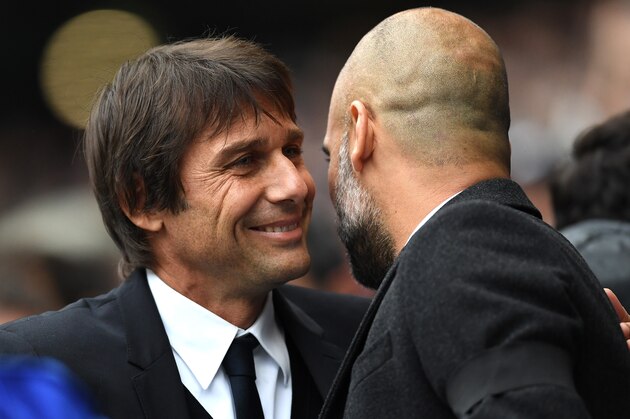 MANCHESTER, ENGLAND - DECEMBER 03:  Antonio Conte, Manager of Chelsea and Josep Guardiola, Manager of Manchester City greet prior to the Premier League match between Manchester City and Chelsea at Etihad Stadium on December 3, 2016 in Manchester, England.  (Photo by Laurence Griffiths/Getty Images)