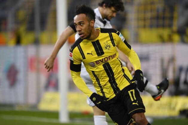Dortmund's Pierre-Emerick Aubameyang returns after scoring during the German Bundesliga soccer match between Borussia Dortmund and Borussia Moenchengladbach in Dortmund, Germany, Saturday, Dec. 3, 2016. (AP Photo/Martin Meissner)