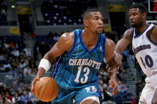 19 Dec 1998:  Guard Bobby Phills of the Charlotte Hornets dribbles around guard Calbert Cheaney of the Washington Wizards during a game  at the MCI Center in Washington, D. C. The Wizards defeated the Hornets 106-86. Mandatory Credit: Doug Pensinger  /All