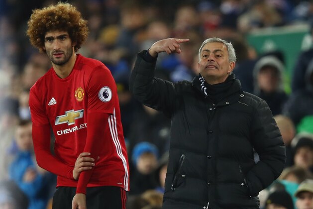 LIVERPOOL, ENGLAND - DECEMBER 04:  Jose Mourinho manager of Manchester United stands alongside his substitute Marouane Fellaini of Manchester United during the Premier League match between Everton and Manchester United at Goodison Park on December 4, 2016 in Liverpool, England.  (Photo by Clive Brunskill/Getty Images)