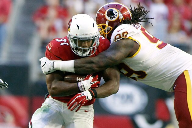 GLENDALE, AZ - DECEMBER 04:  Running back David Johnson #31 of the Arizona Cardinals runs the ball as he is tackled by Ricky Jean Francois #99 of the Washington Redskins during the second quarter of a game at University of Phoenix Stadium on December 4, 2016 in Glendale, Arizona.  The Cardinals defeated the Redskins 31-23. (Photo by Ralph Freso/Getty Images)