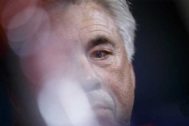 FC Bayern Munich head coach  Carlo Ancelotti listens to a question from a journalist during a press conference before a training session ahead of Wednesday's Champions League soccer match between Atletico de Madrid and Bayern Munich, in Madrid, Spain, Tuesday, Sept. 27, 2016 . (AP Photo/Daniel Ochoa de Olza)