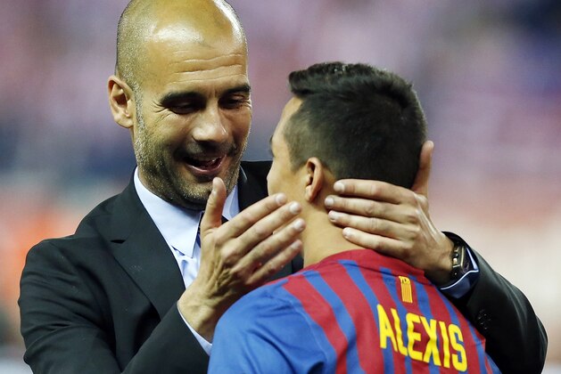 MADRID, SPAIN - MAY 25:  Head coach Pepe Guardiola (L) of Barcelona embraces Alexis Sanchez after their victory in the Copa del Rey Final match between Athletic Bilbao and Barcelona at Vicente Calderon Stadium on May 25, 2012 in Madrid, Spain.  (Photo by Angel Martinez/Getty Images)