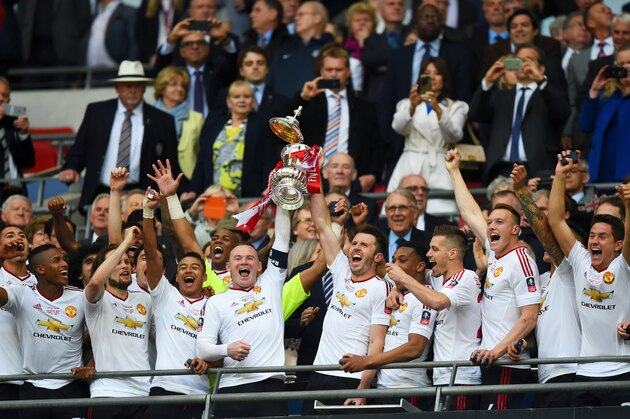 LONDON, ENGLAND - MAY 21:  Wayne Rooney and Michael Carrick of Manchester United lift the trophy after winning The Emirates FA Cup Final match between Manchester United and Crystal Palace at Wembley Stadium on May 21, 2016 in London, England.  (Photo by Shaun Botterill/Getty Images)