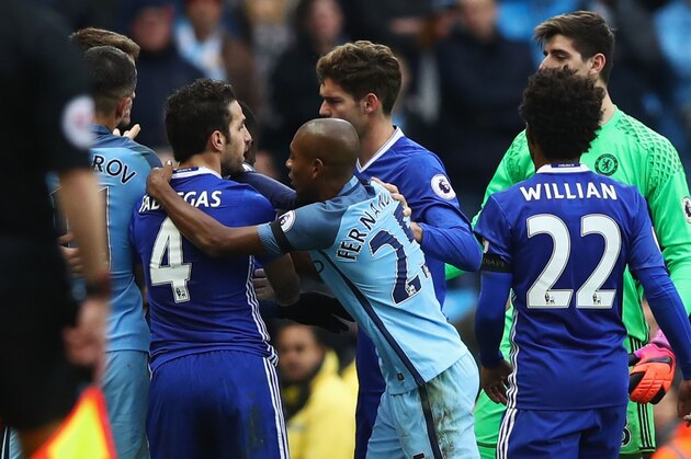 MANCHESTER, ENGLAND - DECEMBER 03:  Cesc Fabregas of Chelsea and Fernandinho of Manchester City clash during the Premier League match between Manchester City and Chelsea at Etihad Stadium on December 3, 2016 in Manchester, England.  (Photo by Clive Brunskill/Getty Images)