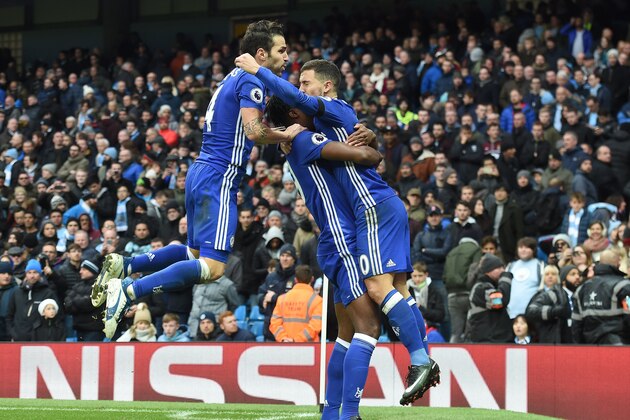 Chelsea's Belgian midfielder Eden Hazard celebrates scoring his team's third goal during the English Premier League football match between Manchester City and Chelsea at the Etihad Stadium in Manchester, north west England, on December 3, 2016. / AFP / Paul ELLIS / RESTRICTED TO EDITORIAL USE. No use with unauthorized audio, video, data, fixture lists, club/league logos or 'live' services. Online in-match use limited to 75 images, no video emulation. No use in betting, games or single club/league/player publications.  /         (Photo credit should read PAUL ELLIS/AFP/Getty Images)