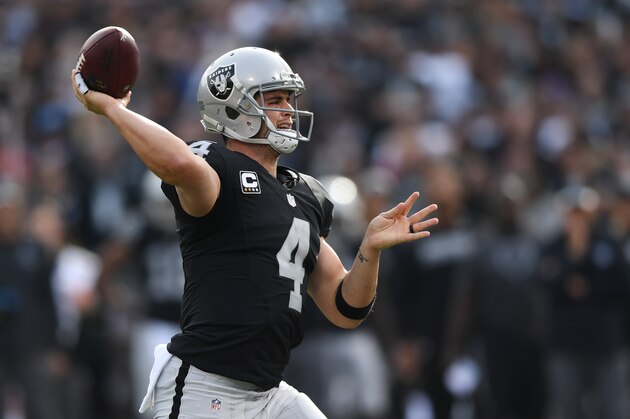 OAKLAND, CA - DECEMBER 04:  Derek Carr #4 of the Oakland Raiders looks to pass against the Buffalo Bills during their NFL game at Oakland Alameda Coliseum on December 4, 2016 in Oakland, California.  (Photo by Thearon W. Henderson/Getty Images)