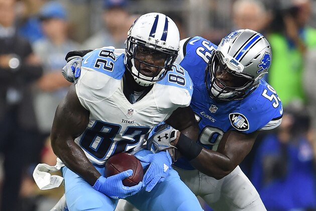 DETROIT, MI - SEPTEMBER 18:  Delanie Walker #82 of the Tennessee Titans is brought down by Tahir Whitehead #59 of the Detroit Lions during the first half of a game at Ford Field on September 18, 2016 in Detroit, Michigan.  (Photo by Stacy Revere/Getty Images)