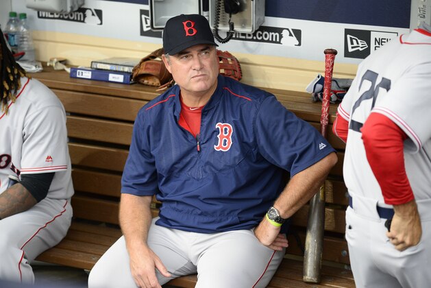 SAN DIEGO, CALIFORNIA - SEPTEMBER 7:  John Farrell #53 of the Boston Red Sox sits in the dugout before a baseball game against the San Diego Padres at PETCO Park on September 7, 2016 in San Diego, California.  (Photo by Denis Poroy/Getty Images)