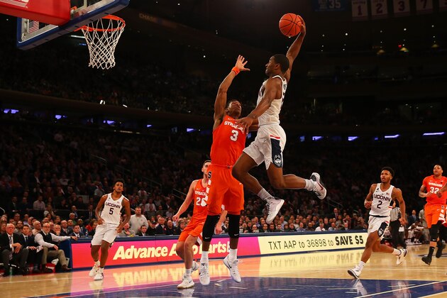 NEW YORK, NY - DECEMBER 05:  Rodney Purvis #15 of the Connecticut Huskies drives to the net against Andrew White III #3 of the Syracuse Orange during the Tire Pros Classic at Madison Square Garden on December 5, 2016 in New York City.  (Photo by Mike Stobe/Getty Images)