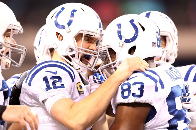 EAST RUTHERFORD, NJ - DECEMBER 05:   Dwayne Allen #83 celebrates his second touchdown in the first quarter against the New York Jets with teammate  Andrew Luck #12 of the Indianapolis Colts during their game at MetLife Stadium on December 5, 2016 in East Rutherford, New Jersey.  (Photo by Elsa/Getty Images)