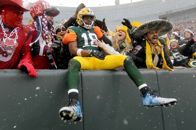 GREEN BAY, WI - DECEMBER 04:  Randall Cobb #18 of the Green Bay Packers celebrates with fans with a 'Lambeau Leap' after scoring a touchdown in the second quarter against the Houston Texans at Lambeau Field on December 4, 2016 in Green Bay, Wisconsin. (Photo by Dylan Buell/Getty Images)