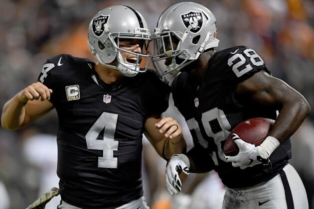 OAKLAND, CA - NOVEMBER 06:  Latavius Murray #28 and Derek Carr #4 of the Oakland Raiders celebrates after Murray scored a touchdown against the Denver Broncos in the second quarter of an NFL football game at the Oakland-Alameda County Coliseum on November 6, 2016 in Oakland, California.  (Photo by Thearon W. Henderson/Getty Images)