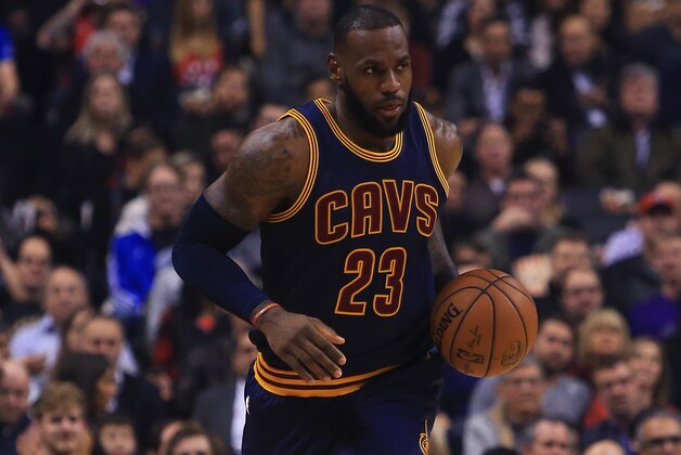 TORONTO, ON - DECEMBER 05:  Lebron James #23 of the Cleveland Cavaliers dribbles the ball during the first half of an NBA game against the Toronto Raptors at Air Canada Centre on December 5, 2016 in Toronto, Canada.  NOTE TO USER: User expressly acknowledges and agrees that, by downloading and or using this photograph, User is consenting to the terms and conditions of the Getty Images License Agreement.  (Photo by Vaughn Ridley/Getty Images)