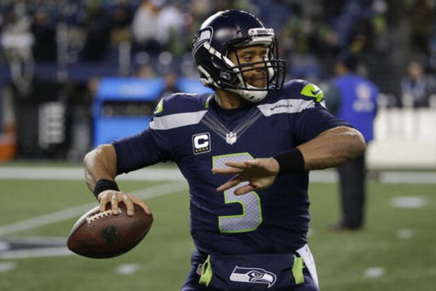 Seattle Seahawks quarterback Russell Wilson passes during warmups before an NFL football game against the Carolina Panthers, Sunday, Dec. 4, 2016, in Seattle. (AP Photo/Ted S. Warren)