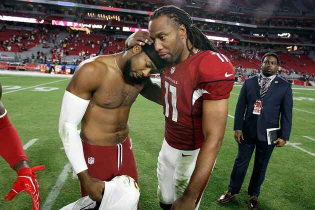 GLENDALE, AZ - DECEMBER 04:  Larry Fitzgerald #11 of the Arizona Cardinals embraces Josh Norman #24 of the Washington Redskins following a game at University of Phoenix Stadium on December 4, 2016 in Glendale, Arizona.  The Cardinals defeated the Redskins 31-23.  (Photo by Ralph Freso/Getty Images)