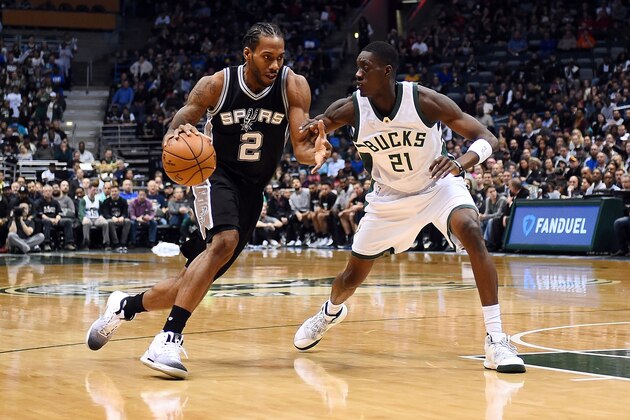 MILWAUKEE, WI - DECEMBER 05:  Kawhi Leonard #2 of the San Antonio Spurs drives to the basket against Tony Snell #21 of the Milwaukee Bucks during the first half of a game at the BMO Harris Bradley Center on December 5, 2016 in Milwaukee, Wisconsin.  NOTE TO USER: User expressly acknowledges and agrees that, by downloading and or using this photograph, User is consenting to the terms and conditions of the Getty Images License Agreement.  (Photo by Stacy Revere/Getty Images)