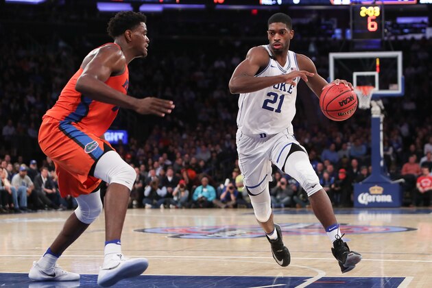 NEW YORK, NY - DECEMBER 06:  Amile Jefferson #21 of the Duke Blue Devils drives to the basket against John Egbunu #15 of the Florida Gators in the second half during the Jimmy V Classic at Madison Square Garden on December 6, 2016 in New York City.  (Photo by Michael Reaves/Getty Images)
