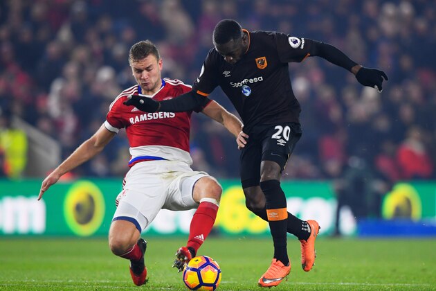 MIDDLESBROUGH, ENGLAND - DECEMBER 05:  Adama Diomande of Hull City battles with Ben Gibson of Middlesbrough during the Premier League match between Middlesbrough and Hull City at Riverside Stadium on December 5, 2016 in Middlesbrough, England.  (Photo by Stu Forster/Getty Images)
