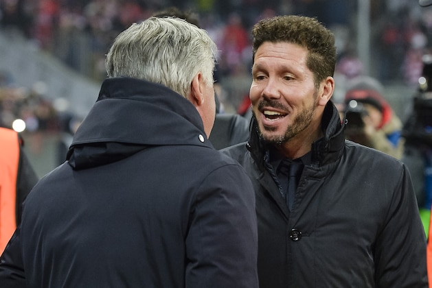 Bayern Munich's Italian head coach Carlo Ancelotti (L) greets Atletico Madrid's head coach Diego Simeone as tehy arrive for the UEFA Champions League group D football match between FC Bayern Munich and Atletico Madrid in Munich, southern Germany, on December 6, 2016.  / AFP / GUENTER SCHIFFMANN        (Photo credit should read GUENTER SCHIFFMANN/AFP/Getty Images)
