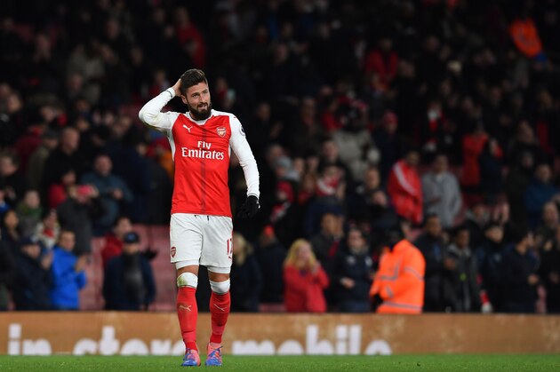 Arsenal's French striker Olivier Giroud gestures on the pitch after the English Premier League football match between Arsenal and Bournemouth at the Emirates Stadium in London on November 27, 2016. 
Arsenal won the game 3-1. / AFP / Ben STANSALL / RESTRICTED TO EDITORIAL USE. No use with unauthorized audio, video, data, fixture lists, club/league logos or 'live' services. Online in-match use limited to 75 images, no video emulation. No use in betting, games or single club/league/player publications.  /         (Photo credit should read BEN STANSALL/AFP/Getty Images)