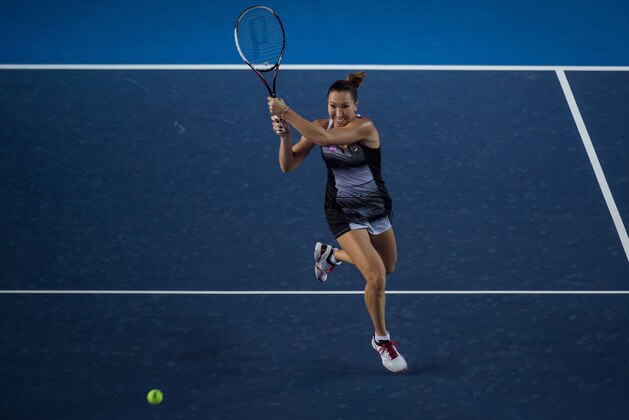 Serbia's Jelena Jankovic hits a return against France's Alize Cornet during their women's singles quarter-final match at the Hong Kong Open tennis tournament on October 14, 2016. / AFP / DALE DE LA REY        (Photo credit should read DALE DE LA REY/AFP/Getty Images)