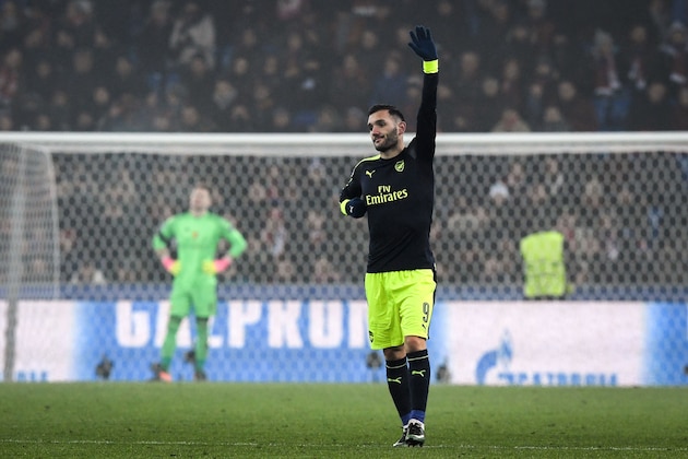 Arsenal's Spanish forward Lucas Perez (R) celebrates his third goal next to Basel's Czech goalkeeper Tomas Vaclik (L) during the UEFA Champions league Group A football match between FC Basel 1893 and Arsenal FC on December 6, 2016 at the St Jakob Park stadium in Basel. / AFP / Patrick HERTZOG        (Photo credit should read PATRICK HERTZOG/AFP/Getty Images)
