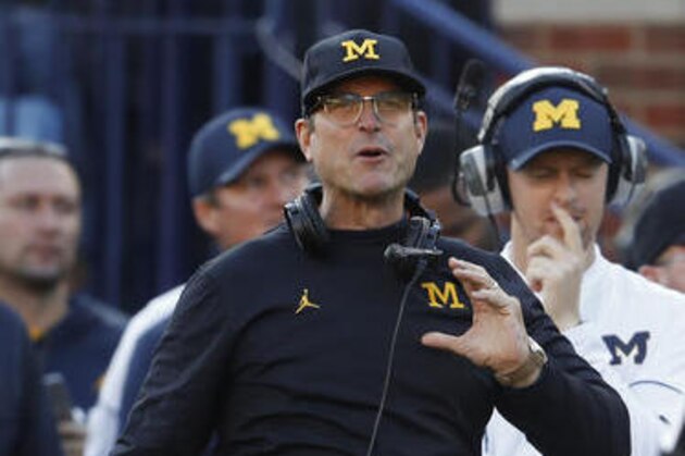 Michigan Wolverines head coach Jim Harbaugh watches against the Maryland Terrapins in the first half of an NCAA college football game in Ann Arbor, Mich., Saturday, Nov. 5, 2016. (AP Photo/Paul Sancya)