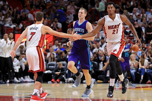 MIAMI, FL - OCTOBER 28: Goran Dragic #7 and Hassan Whiteside #21 of the Miami Heat high five during a game against the Charlotte Hornets at American Airlines Arena on October 28, 2016 in Miami, Florida. NOTE TO USER: User expressly acknowledges and agrees that, by downloading and or using this photograph, User is consenting to the terms and conditions of the Getty Images License Agreement.  (Photo by Mike Ehrmann/Getty Images)