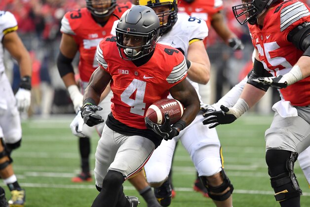 COLUMBUS, OH - NOVEMBER 26:   Curtis Samuel #4 of the Ohio State Buckeyes rushes for the game-winning touchdown in overtime against the Michigan Wolverines at Ohio Stadium on November 26, 2016 in Columbus, Ohio.  (Photo by Jamie Sabau/Getty Images)