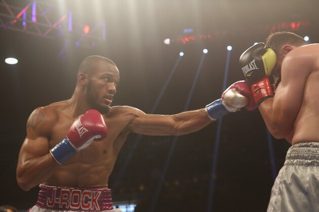 BIRMINGHAM, AL - JUNE 13:  Julian Williams (L) lands a punch on Armen Ovsepyan (R) on June 13, 2015 in Birmingham, Alabama.  (Photo by David A. Smith/Getty Images)