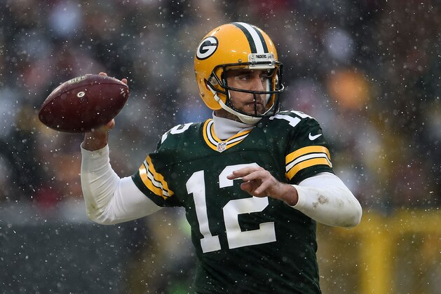 GREEN BAY, WI - DECEMBER 04:  Aaron Rodgers #12 of the Green Bay Packers drops back to pass during a game against the Houston Texans at Lambeau Field on December 4, 2016 in Green Bay, Wisconsin.  Green Bay defeated Houston 21-13.  (Photo by Stacy Revere/Getty Images)
