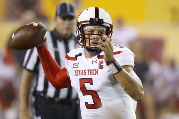 FILE - In this Sept. 10, 2016, file photo, Texas Tech's Patrick Mahomes looks to pass against Arizona State during the first half of an NCAA college football game, in Tempe, Ariz. Patrick Mahomes, Kenny Hill and Shane Buechele are Big 12 starting quarterback with something else in common, they are the sons of former Major League Baseball players. (AP Photo/Ross D. Franklin, File)