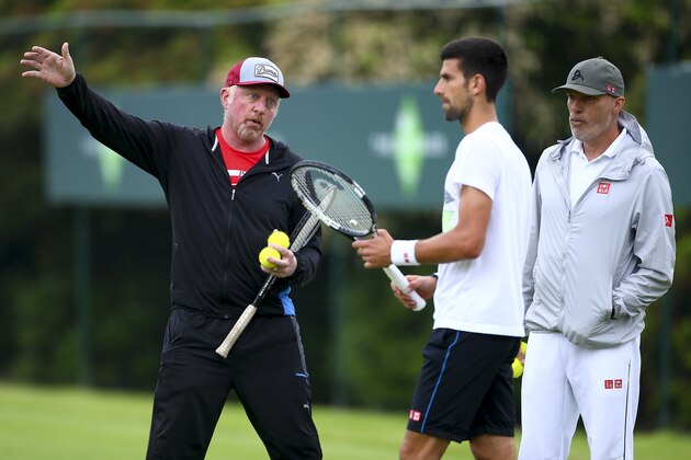 STOKE POGES, ENGLAND - JUNE 22:  Novak Djokovic of Serbia (C) talks with his coach Boris Boris Becker (L) and his fitness coach Gebhard Phil-Gritsch trainer (R) during a practice session during day two of The Boodles Tennis Event at Stoke Park on June 22, 2016 in Stoke Poges, England.  (Photo by Jordan Mansfield/Getty Images)