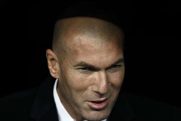 Real Madrid's head coach Zinedine Zidane smiles before the Champions League Group F soccer match between Real Madrid and Borussia Dortmund at the Santiago Bernabeu stadium in Madrid, Spain, Wednesday, Dec. 7, 2016. (AP Photo/Daniel Ochoa de Olza)