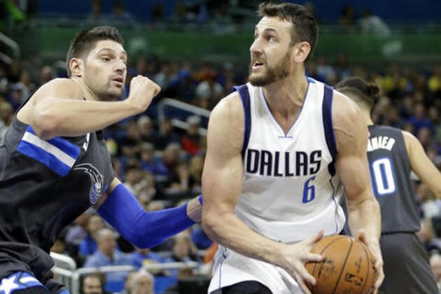 Dallas Mavericks' Andrew Bogut (6) looks for a shot against Orlando Magic's Nikola Vucevic during the first half of an NBA basketball game, Saturday, Nov. 19, 2016, in Orlando, Fla. (AP Photo/John Raoux)