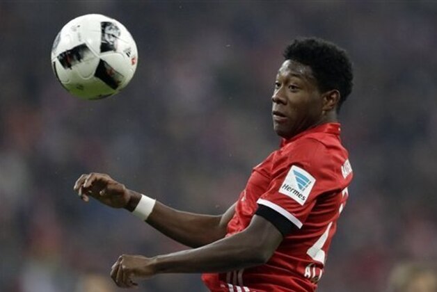 Bayern's David Alaba heads the ball the ball during the German Bundesliga soccer match between FC Bayern Munich and Bayer Leverkusen 04 at the Allianz Arena stadium in Munich, Germany, Saturday, Nov. 26, 2016. (AP Photo/Matthias Schrader)