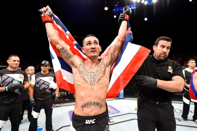 INGLEWOOD, CA - JUNE 04:  Max Holloway celebrates after defeating Ricardo Lamas by unanimous decision in their featherweight bout during the UFC 199 event at The Forum on June 4, 2016 in Inglewood, California.  (Photo by Josh Hedges/Zuffa LLC/Zuffa LLC via Getty Images)