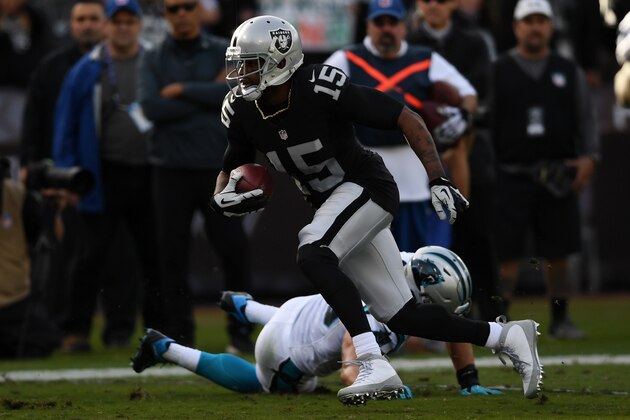 OAKLAND, CA - NOVEMBER 27:  Michael Crabtree #15 of the Oakland Raiders runs after a catch against the Carolina Panthers during their NFL game on November 27, 2016 in Oakland, California.  (Photo by Thearon W. Henderson/Getty Images)